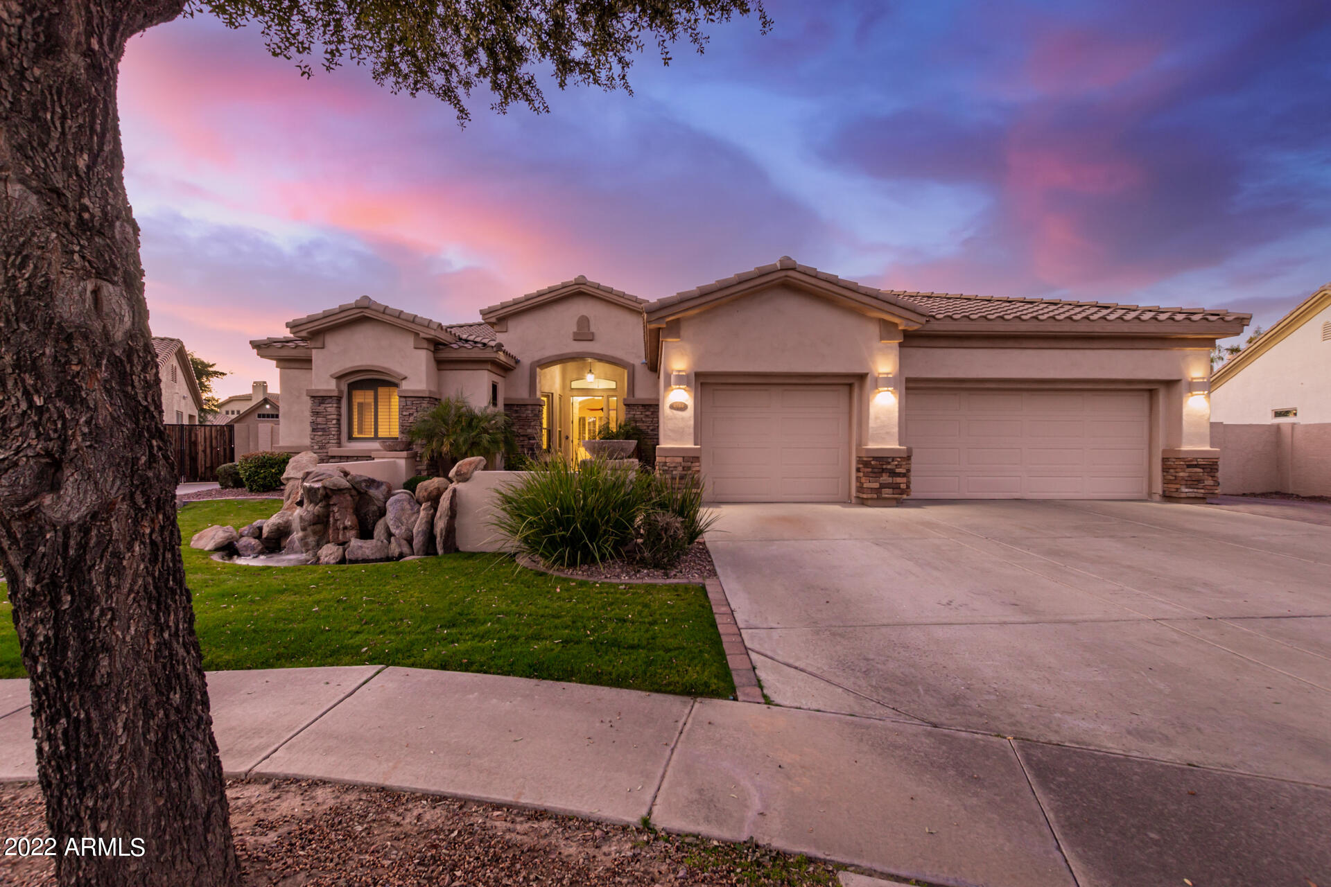 4584 East Reins Road Gilbert, AZ 85297 - Photo 1 of 80 a front view of a house with a garden and yard