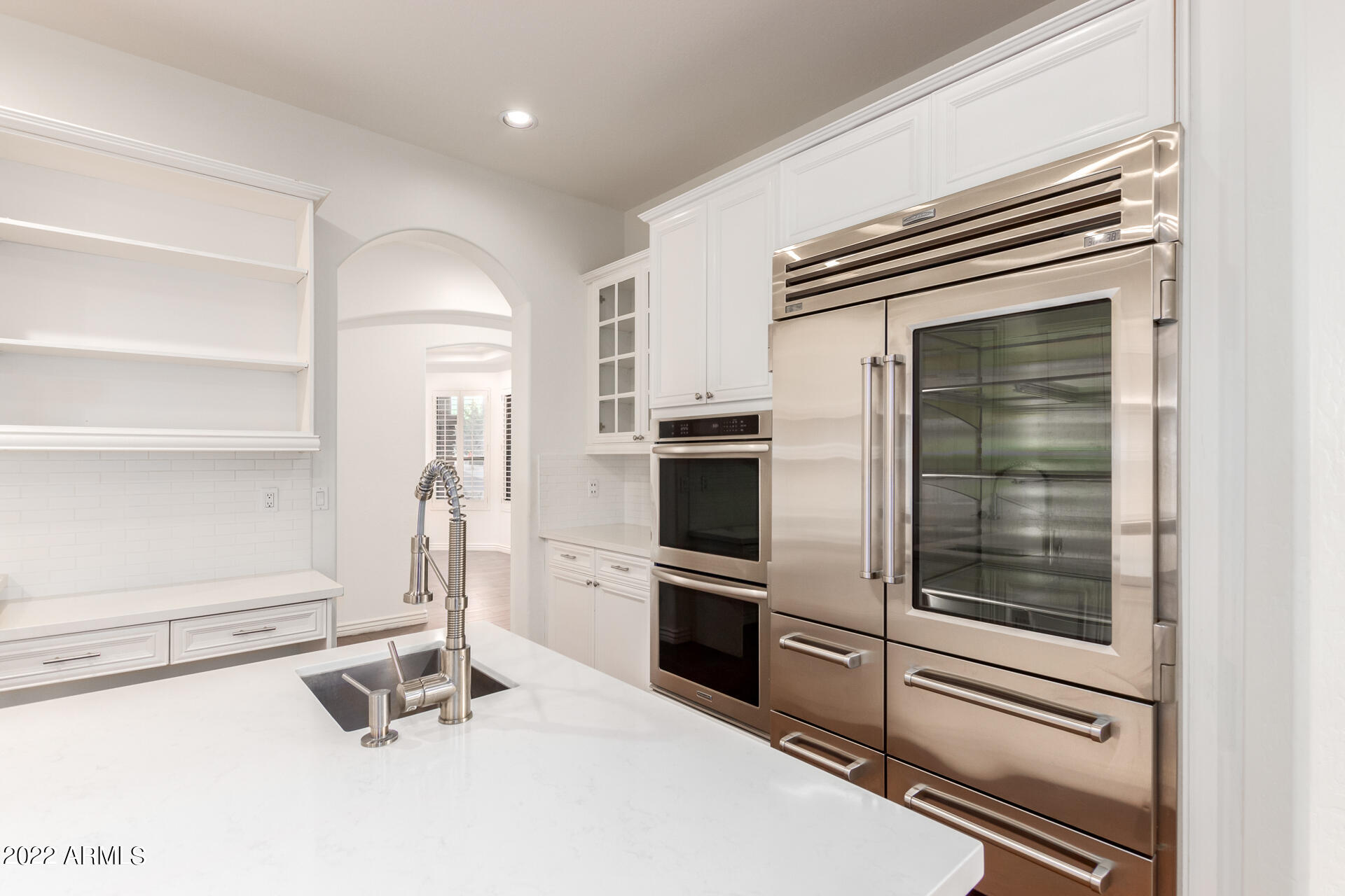 4584 East Reins Road Gilbert, AZ 85297 - Photo 2 of 80 a kitchen with a refrigerator and a stove