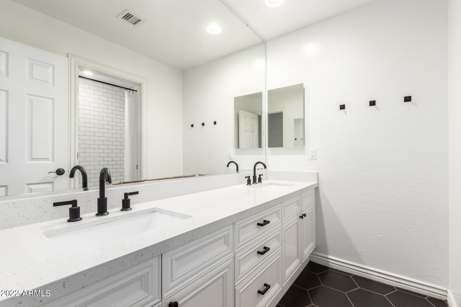 4584 East Reins Road Gilbert, AZ 85297 - Photo 25 of 80 a bathroom with a sink and a mirror