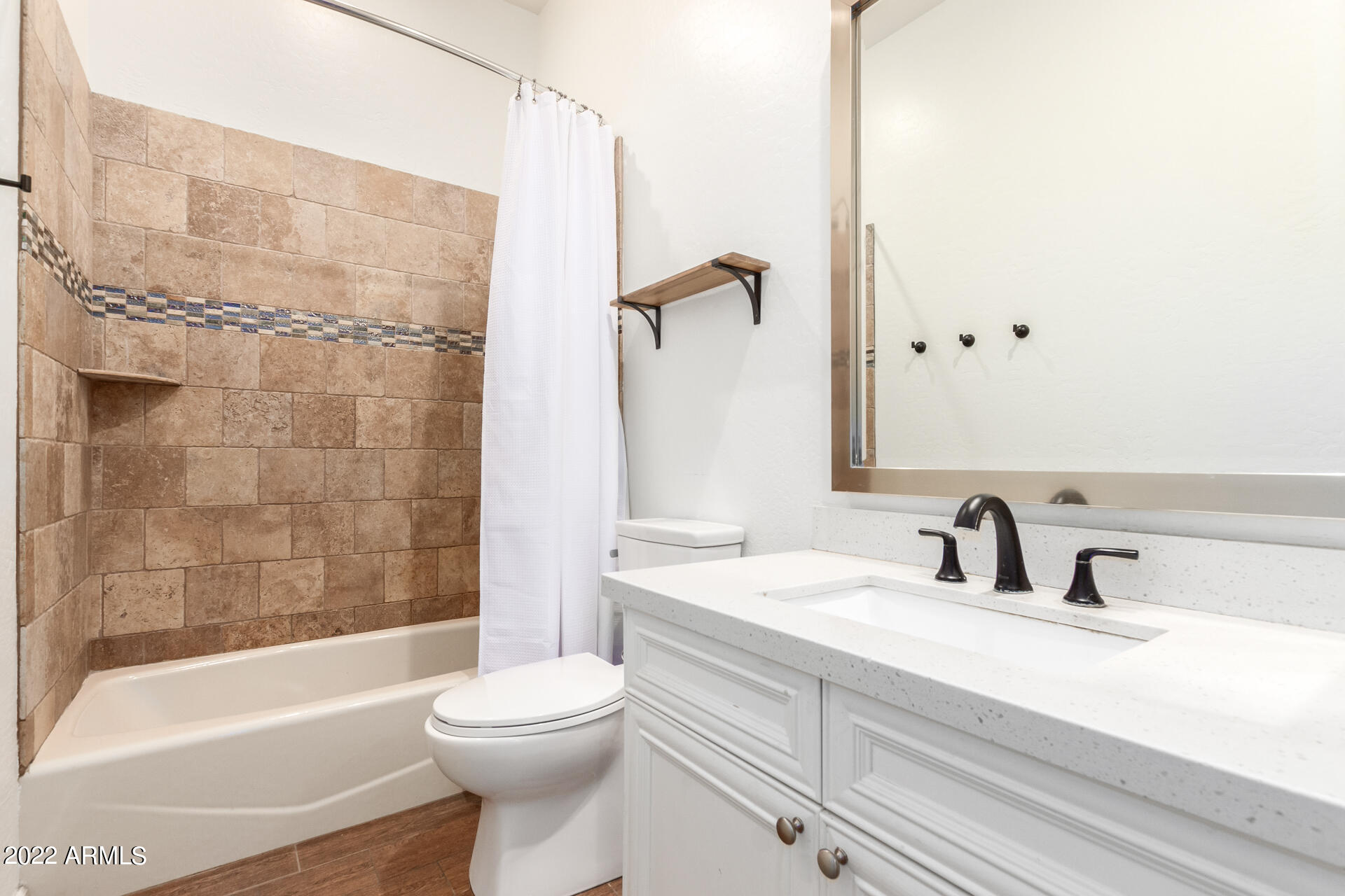4584 East Reins Road Gilbert, AZ 85297 - Photo 33 of 80 a bathroom with a sink a toilet and a bathtub