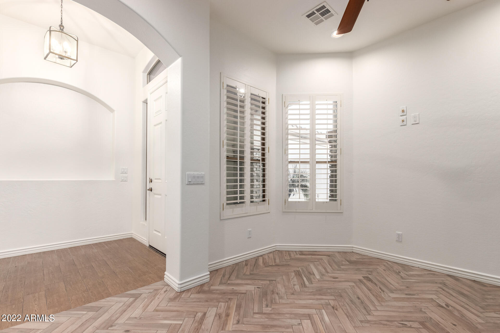 4584 East Reins Road Gilbert, AZ 85297 - Photo 37 of 80 a view of an empty room with window and hardwood floor