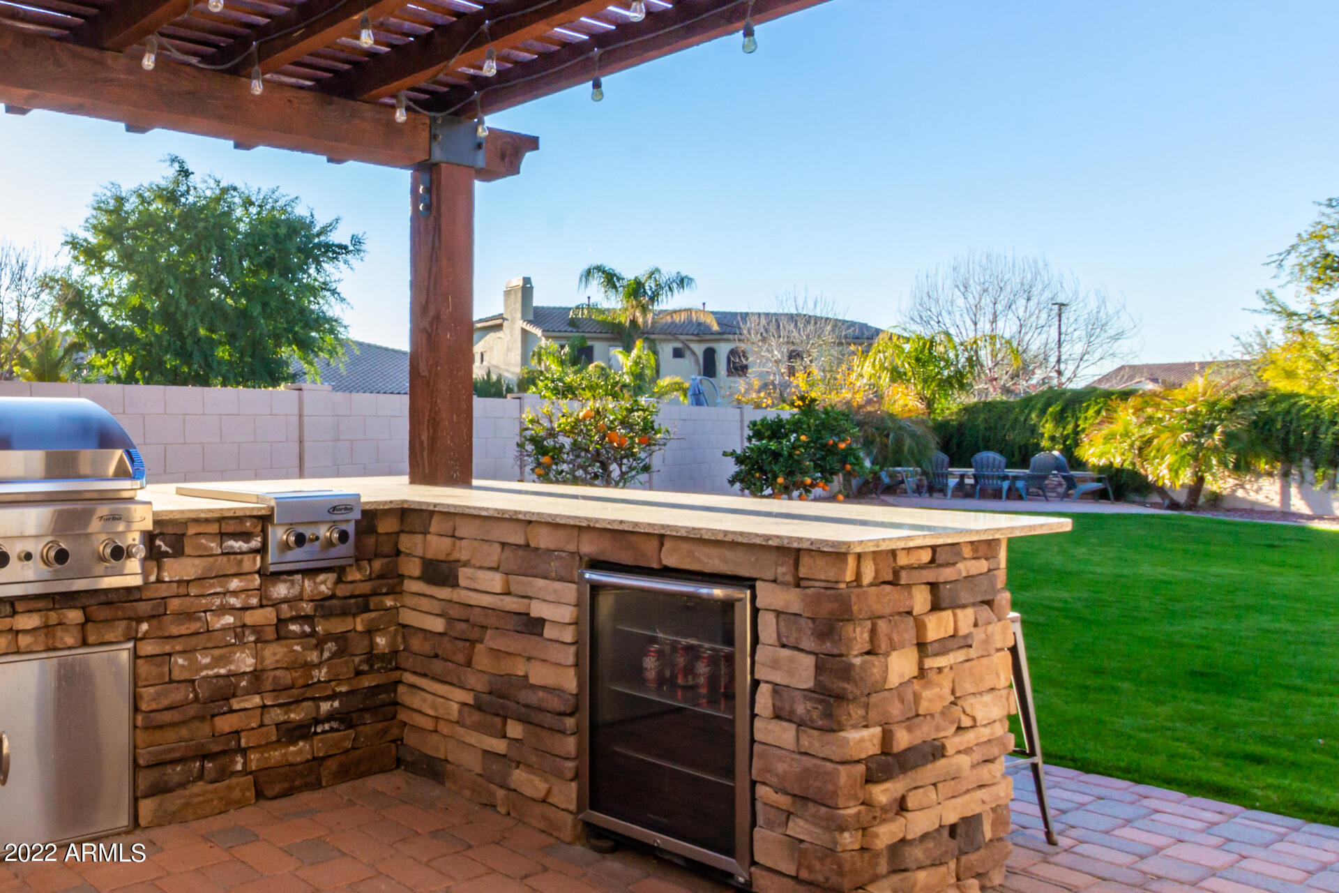 4584 East Reins Road Gilbert, AZ 85297 - Photo 49 of 80 a view of a patio with table and chairs potted plants