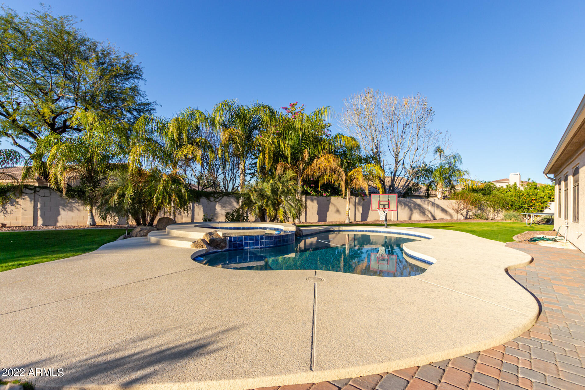 4584 East Reins Road Gilbert, AZ 85297 - Photo 50 of 80 a view of swimming pool with an outdoor space and seating area