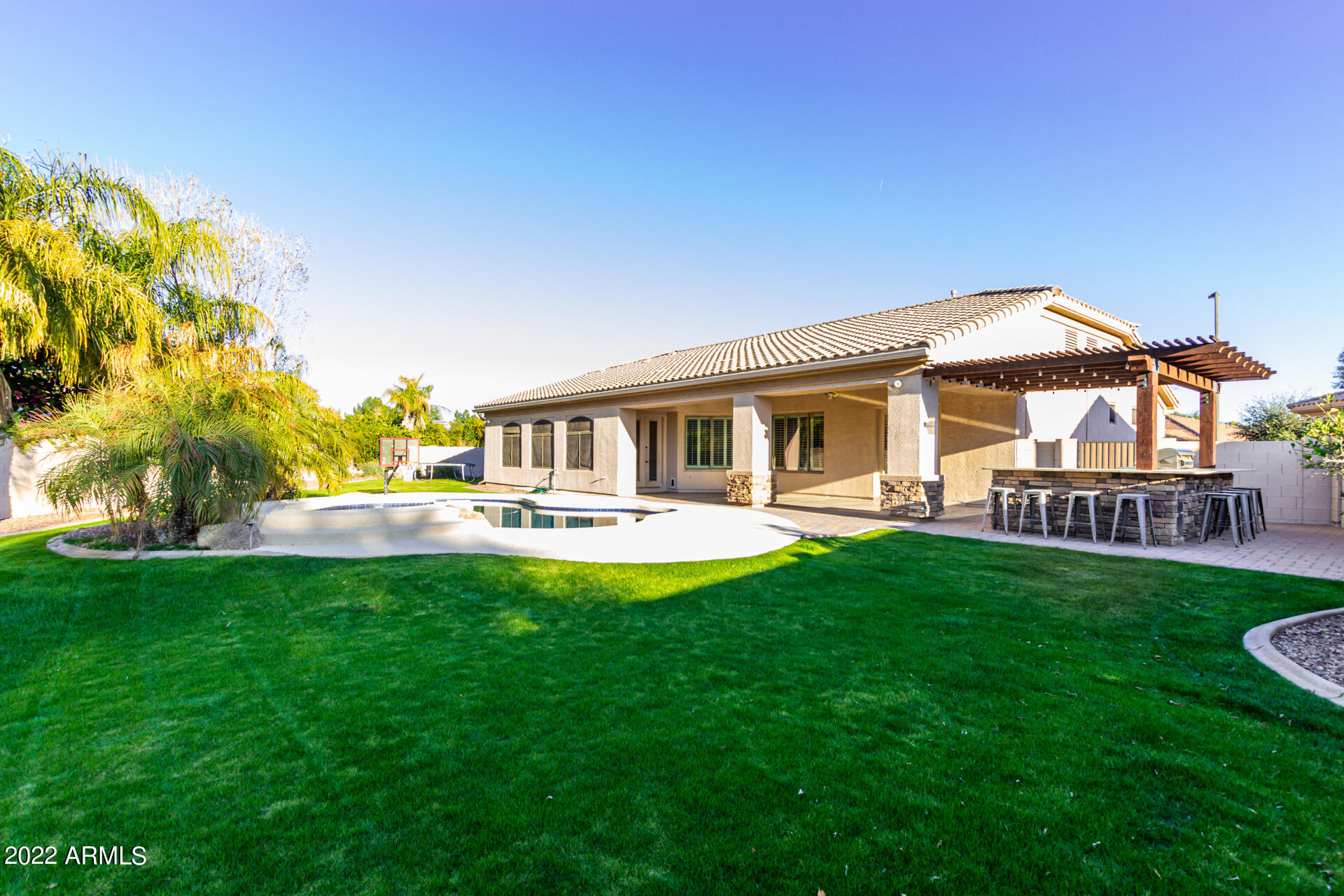 4584 East Reins Road Gilbert, AZ 85297 - Photo 53 of 80 a front view of a house with garden and porch