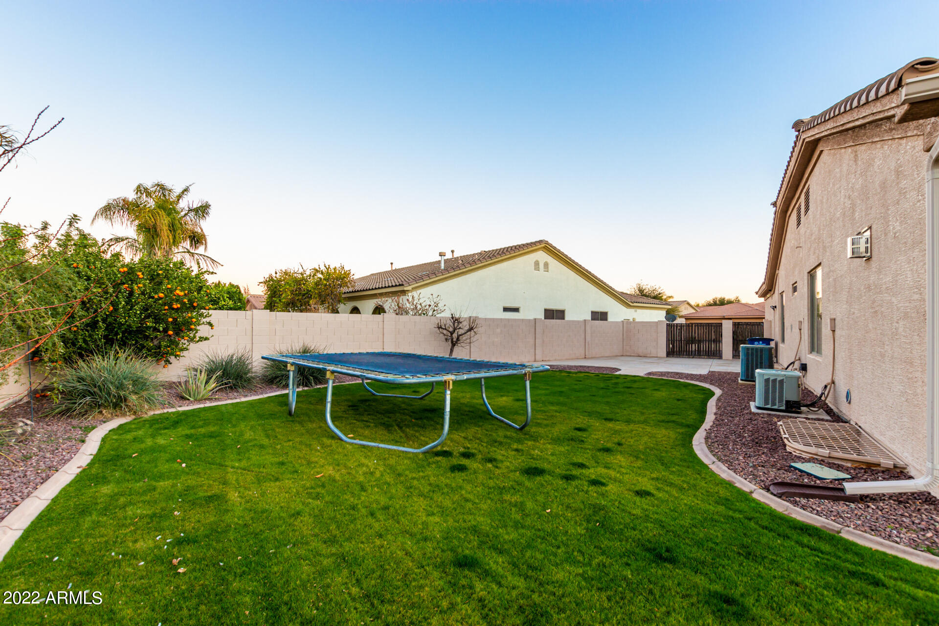 4584 East Reins Road Gilbert, AZ 85297 - Photo 54 of 80 a view of a house with backyard and a garden