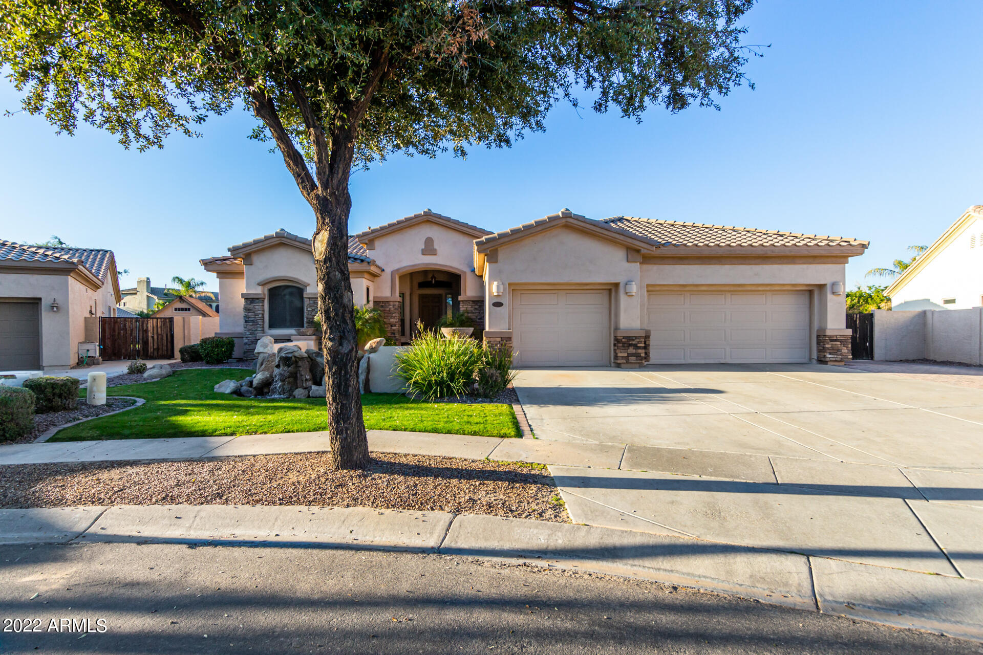 4584 East Reins Road Gilbert, AZ 85297 - Photo 61 of 80 a view of a house with a yard and large tree