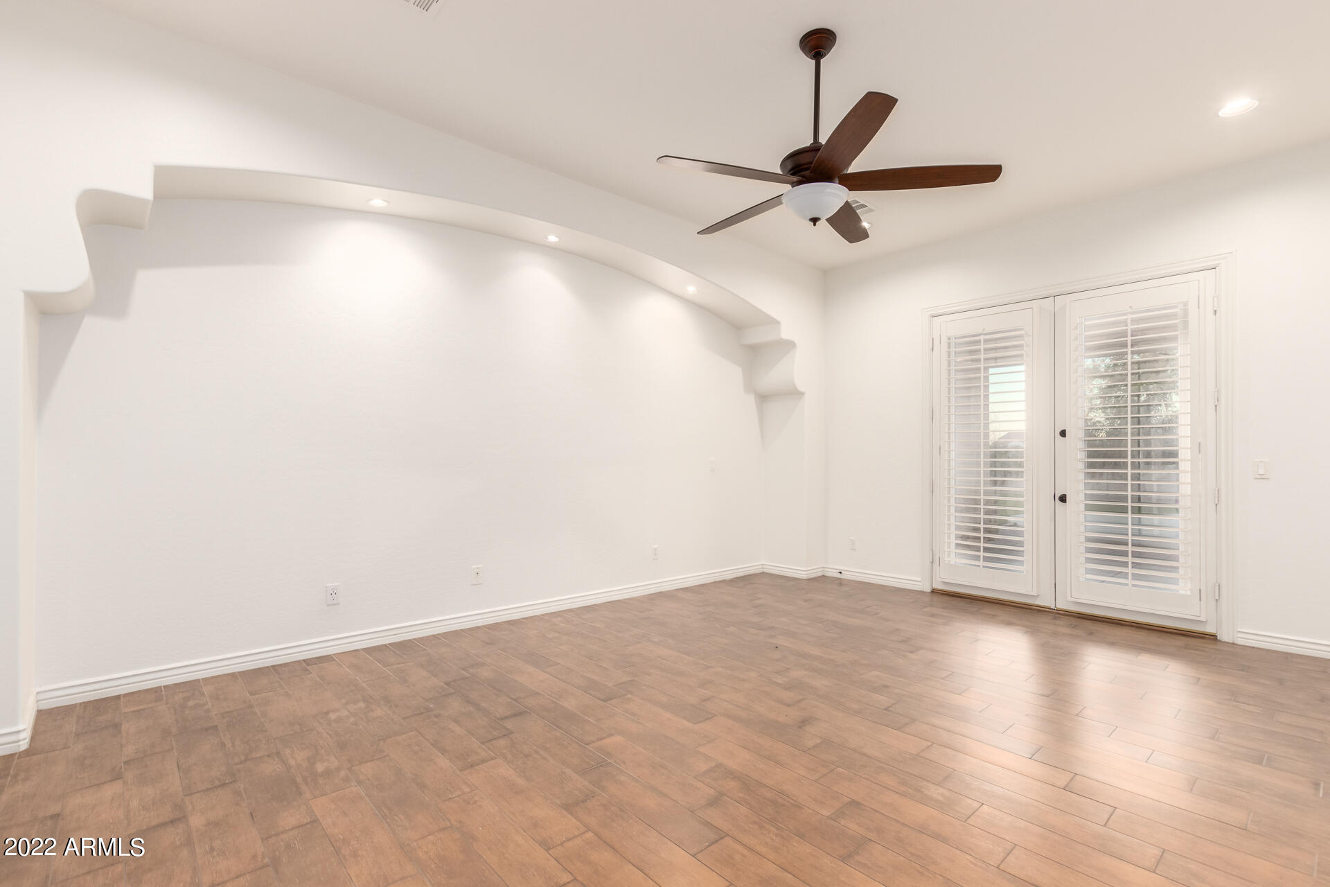 4584 East Reins Road Gilbert, AZ 85297 - Photo 8 of 80 a view of empty room with wooden floor