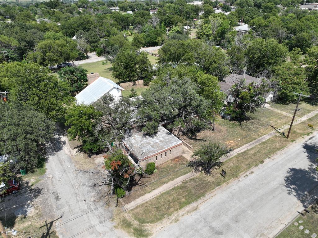 601 East Henry Street Hamilton, TX 76531 - Photo 11 of 40 an aerial view of a house with a yard and lake view