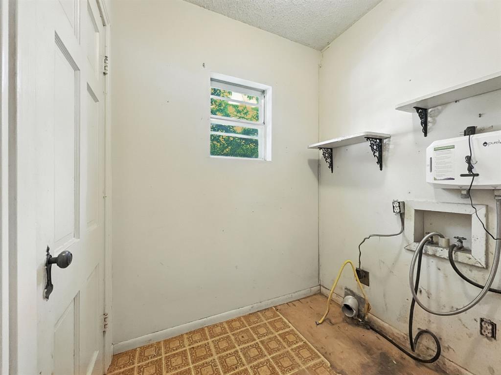 601 East Henry Street Hamilton, TX 76531 - Photo 29 of 40 a view of a room with rack on the wall