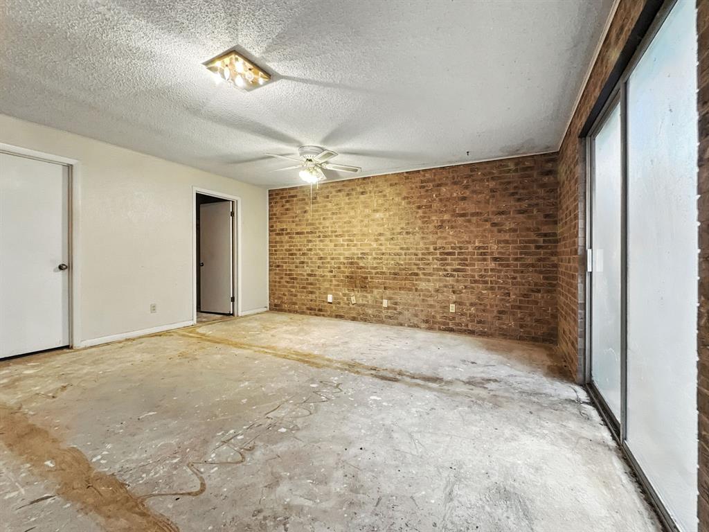 601 East Henry Street Hamilton, TX 76531 - Photo 33 of 40 an empty room with a empty space and windows