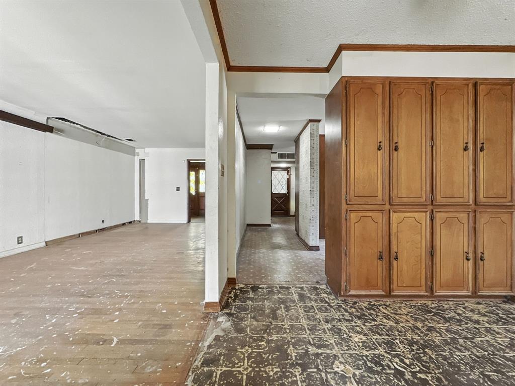601 East Henry Street Hamilton, TX 76531 - Photo 37 of 40 a view of a hallway with wooden walls