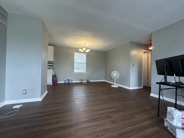 a view of a livingroom with wooden floor