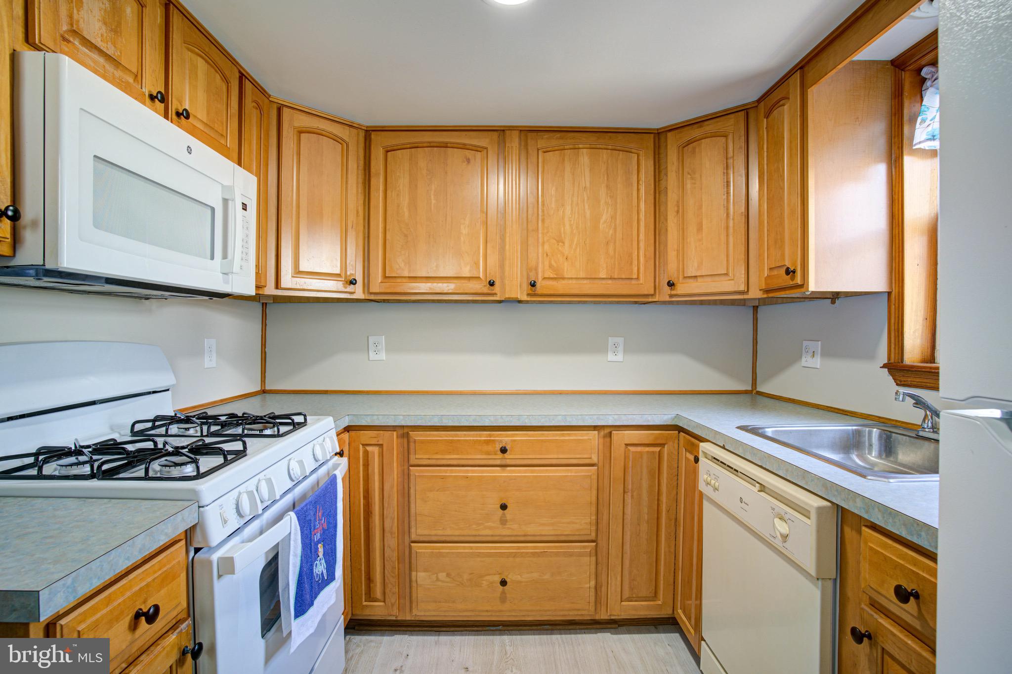 2331 East Hazzard Street Philadelphia, PA 19125 - Photo 18 of 24 a kitchen with granite countertop cabinets and window