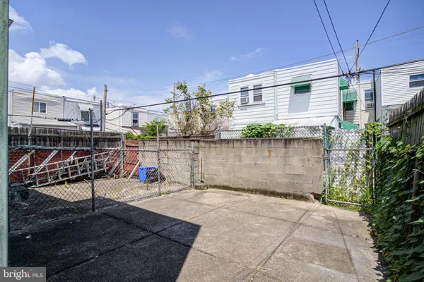 a view of a backyard with sitting area