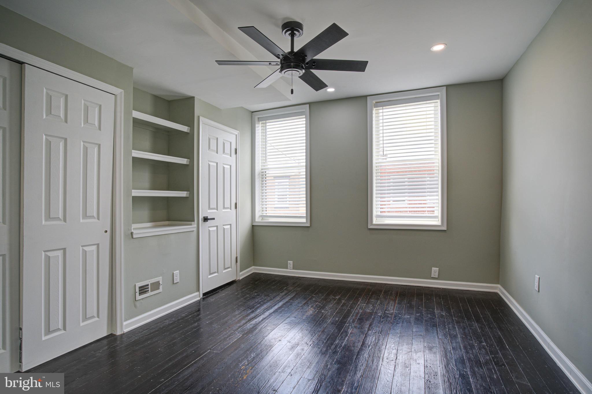 2331 East Hazzard Street Philadelphia, PA 19125 - Photo 2 of 24 wooden floor in an empty room with a window