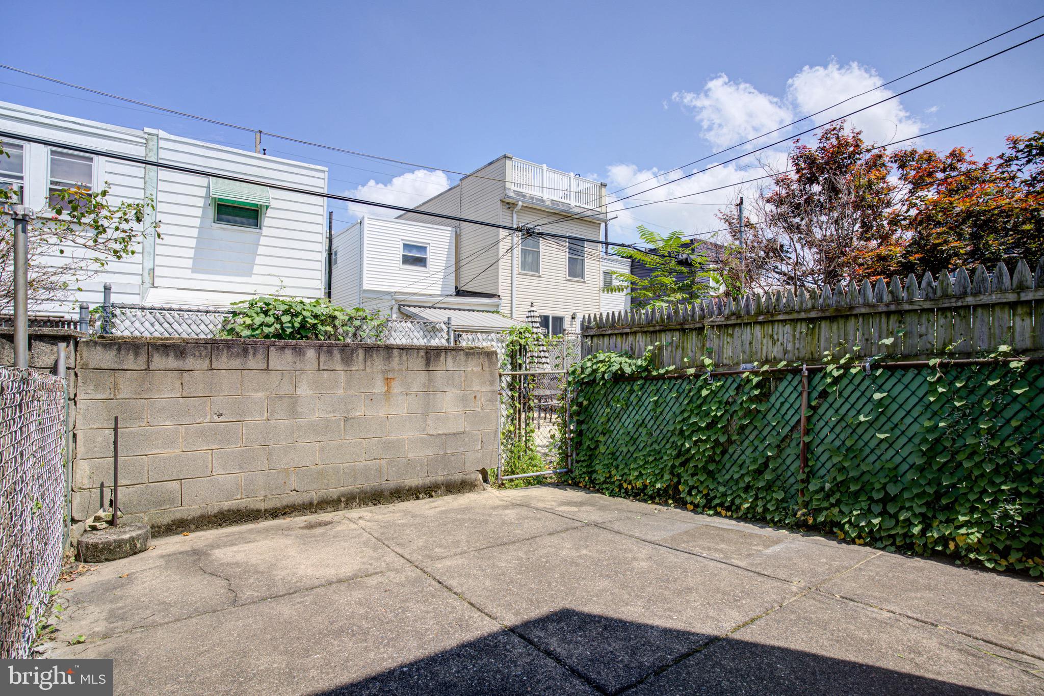 2331 East Hazzard Street Philadelphia, PA 19125 - Photo 21 of 24 a front view of a house with a garden