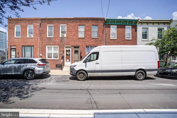 a view of a car parked in front of a house