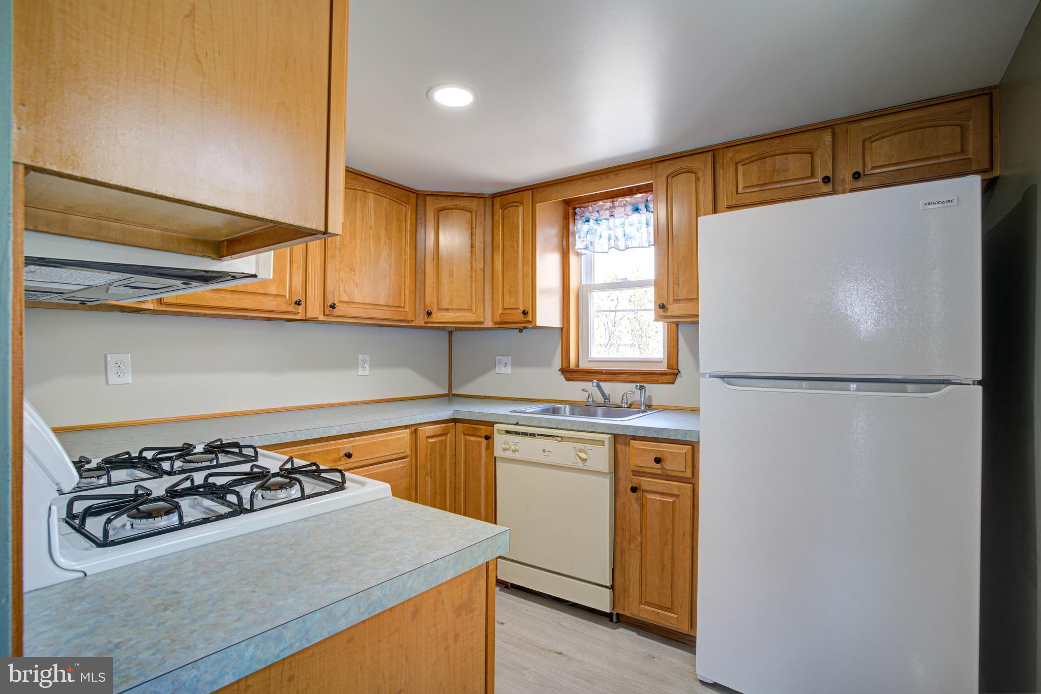 2331 East Hazzard Street Philadelphia, PA 19125 - Photo 3 of 24 a kitchen with a stove a sink and a refrigerator