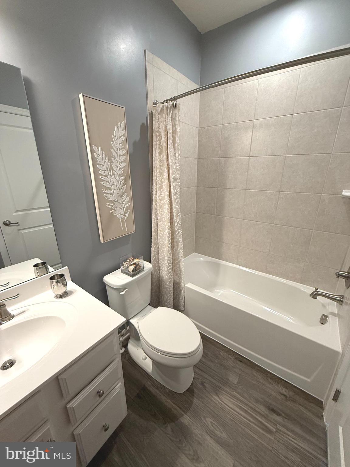 3111 Potters Hill Road Hanover, MD 21076 - Photo 23 of 40 a bathroom with a sink a toilet and shower
