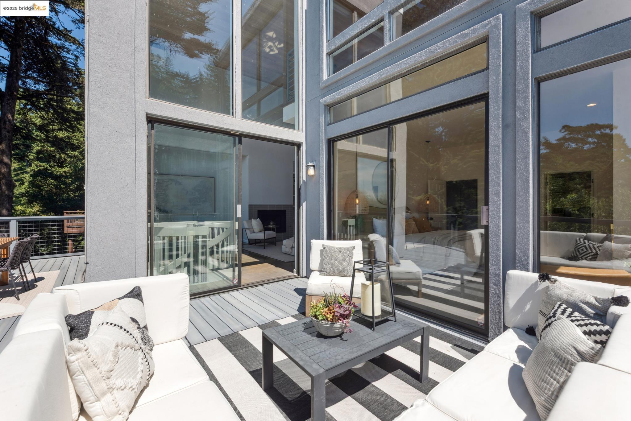 2861 Chelsea Drive Oakland, CA 94611 - Photo 13 of 56 a view of a patio with couches table and chairs and potted plants