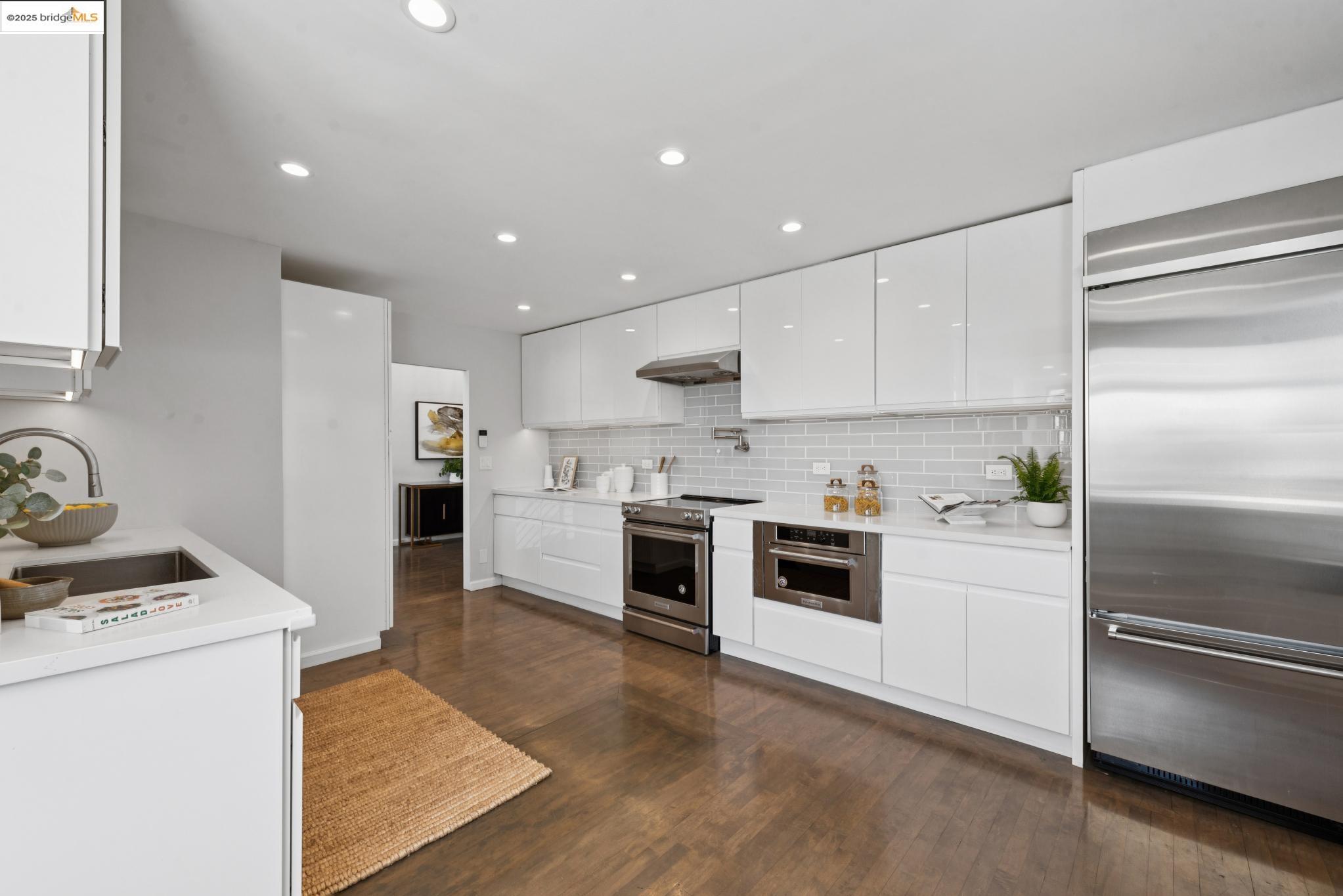 2861 Chelsea Drive Oakland, CA 94611 - Photo 17 of 56 a kitchen with a refrigerator and white stove top oven