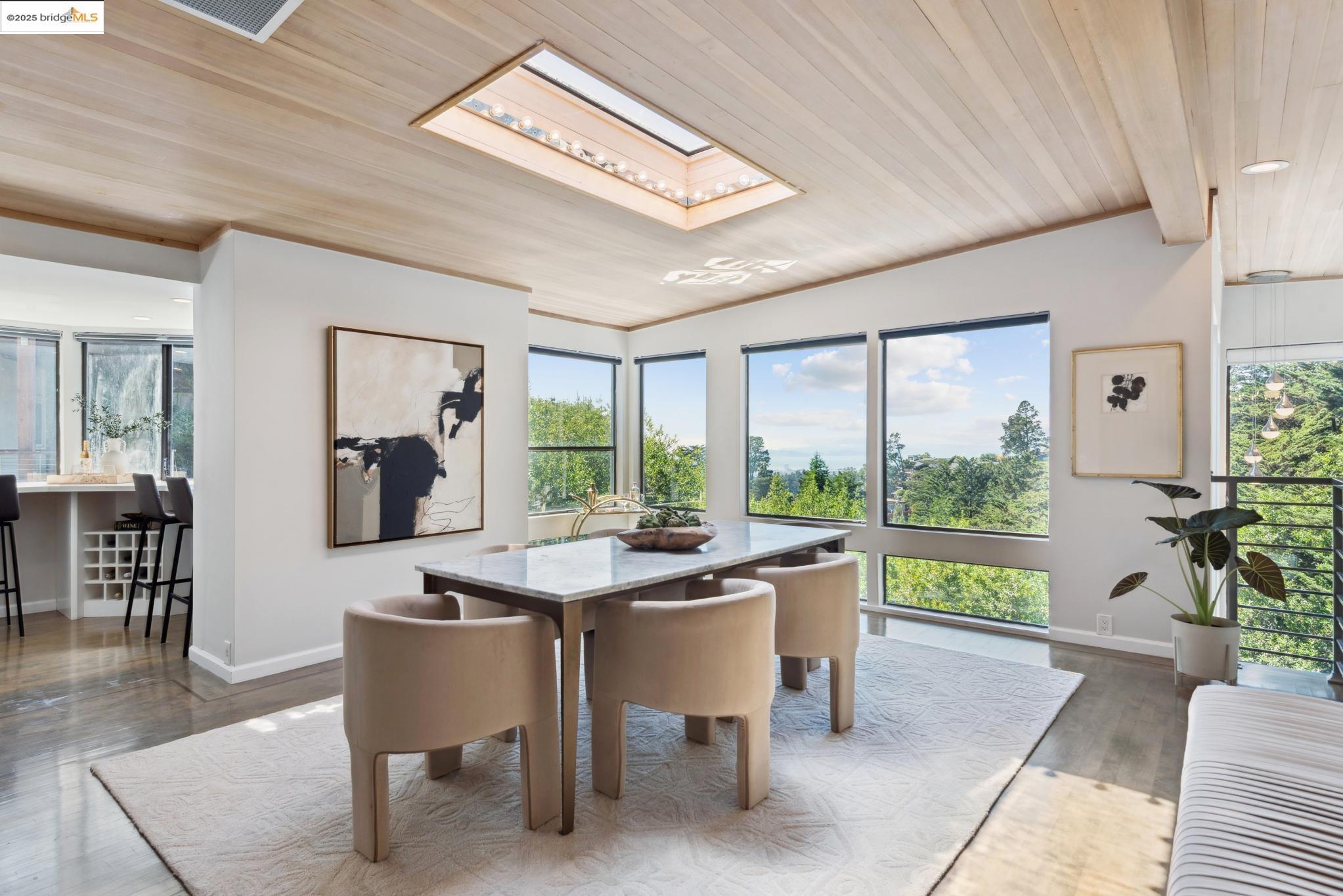 2861 Chelsea Drive Oakland, CA 94611 - Photo 19 of 56 a dining room with furniture a rug and a large window