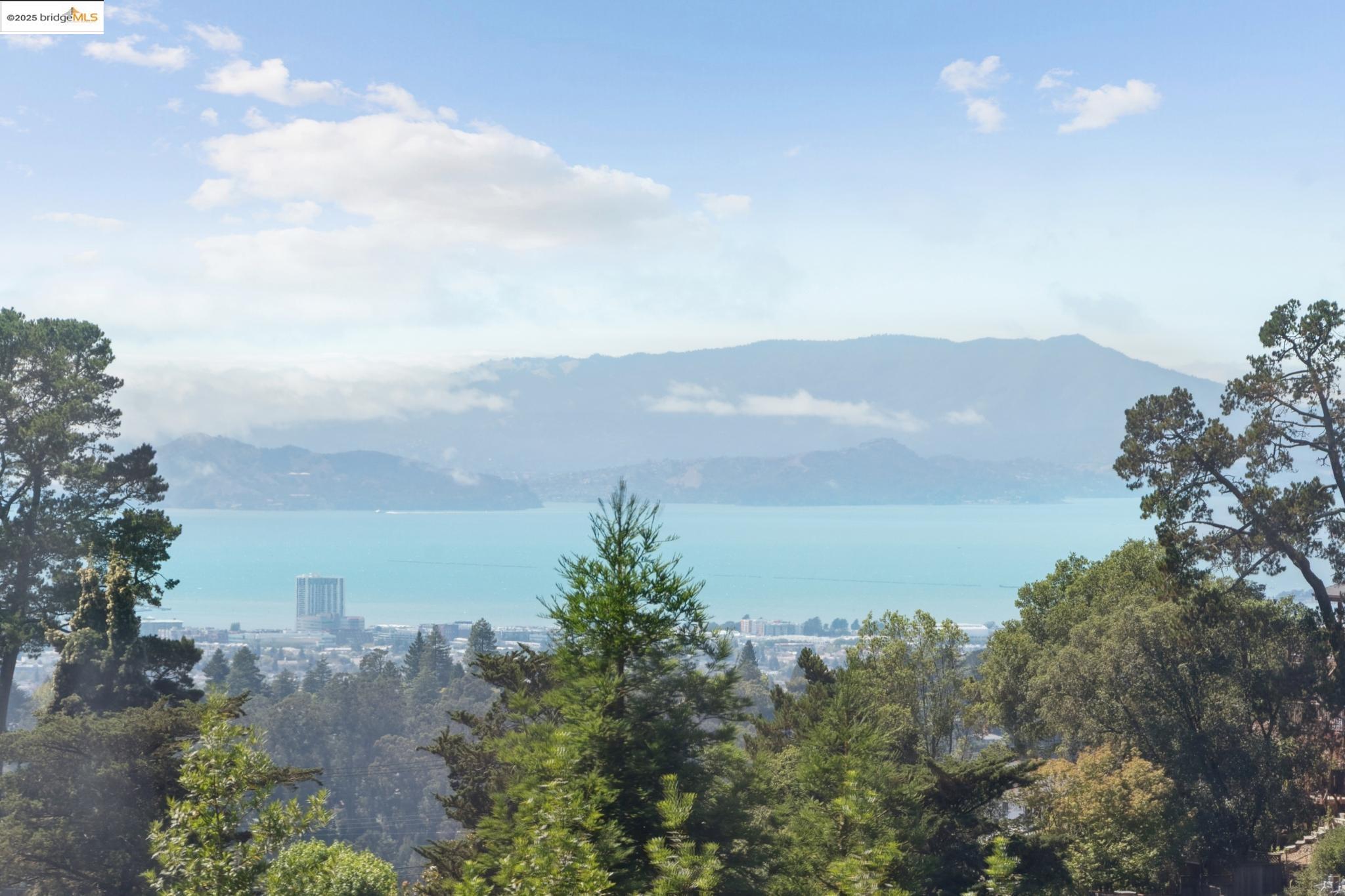 2861 Chelsea Drive Oakland, CA 94611 - Photo 23 of 56 a view of a lake with a mountain in the background