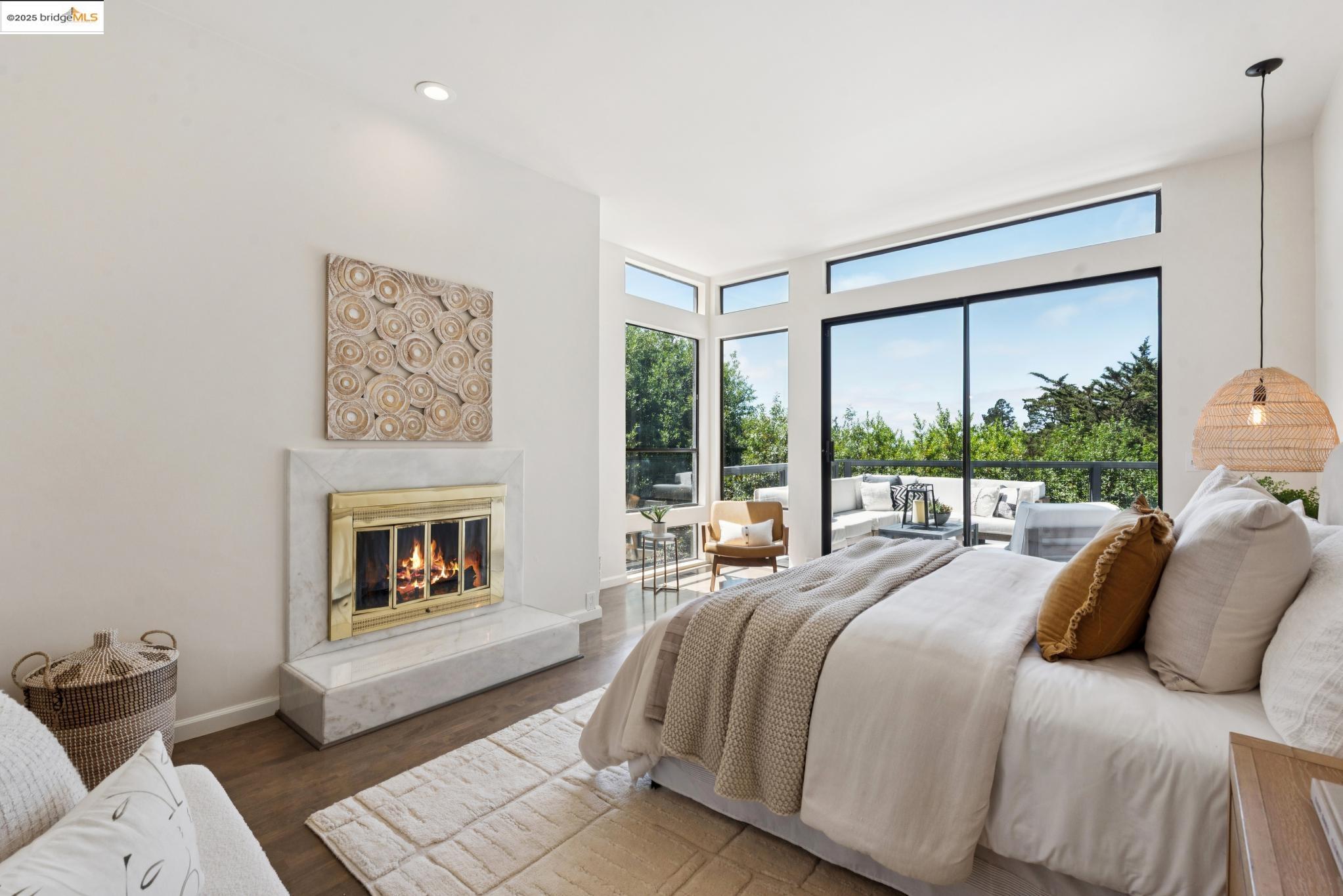 2861 Chelsea Drive Oakland, CA 94611 - Photo 29 of 56 a spacious bedroom with a bed and a fireplace