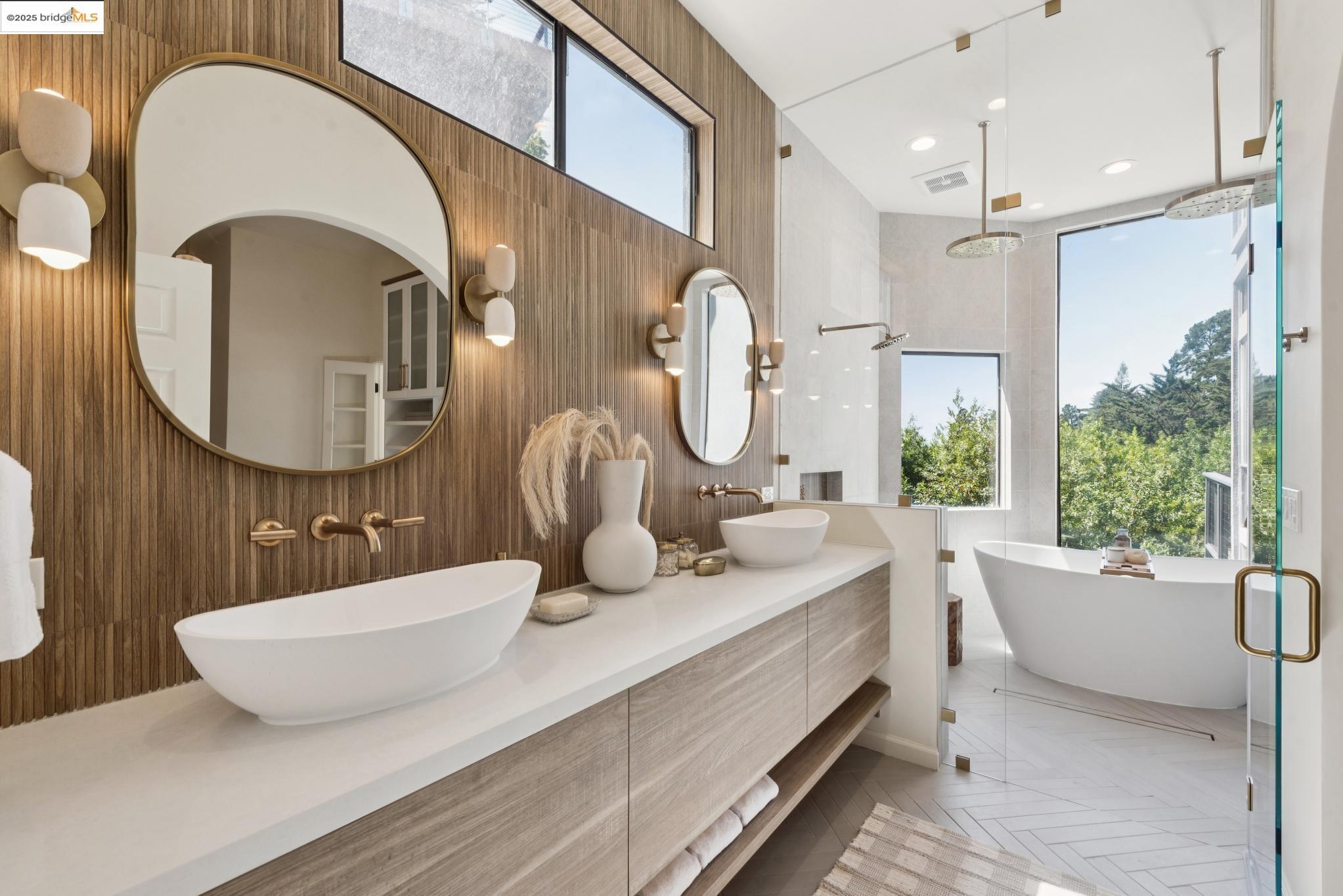 2861 Chelsea Drive Oakland, CA 94611 - Photo 34 of 56 a bathroom with a double vanity sink a mirror and a bathtub