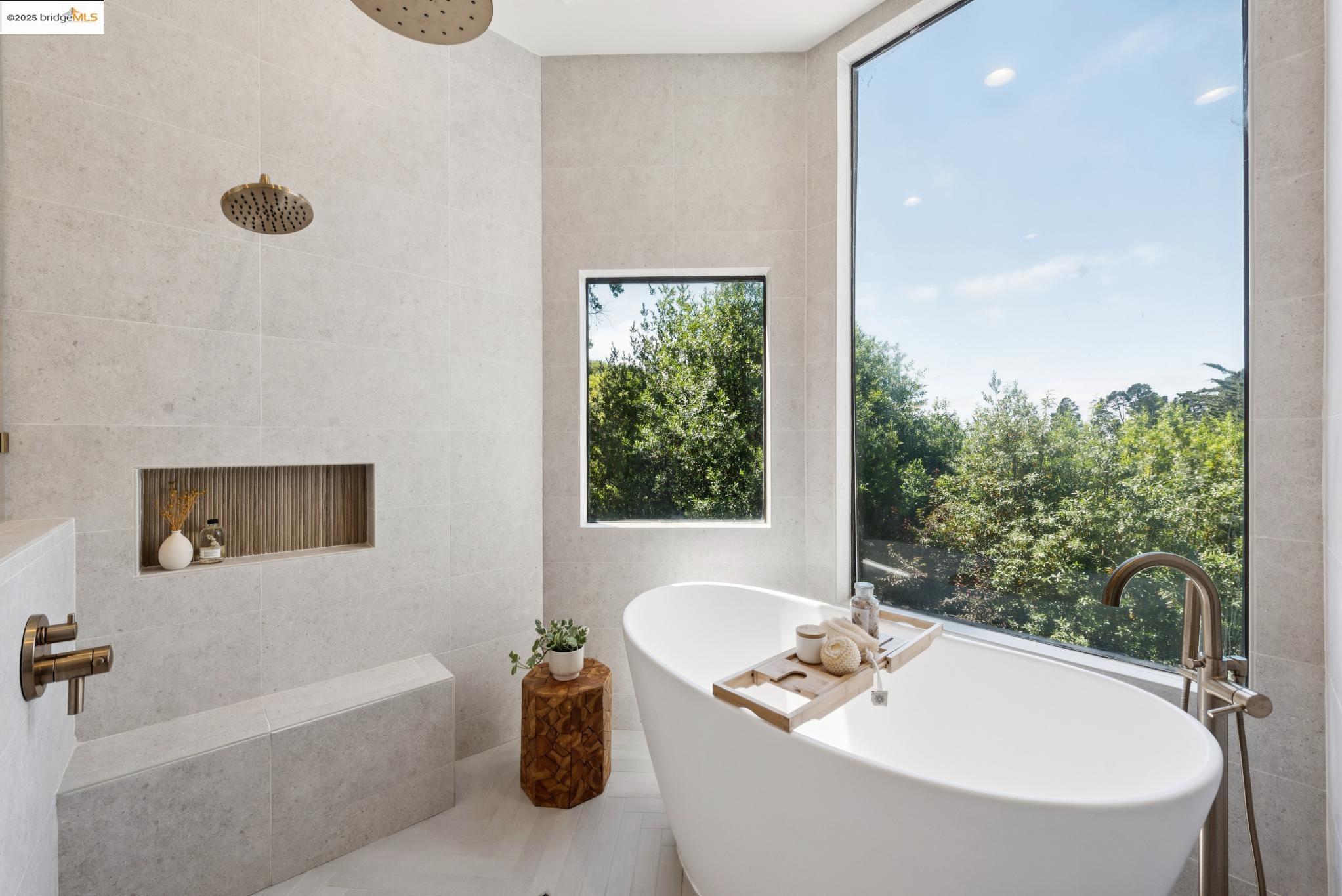 2861 Chelsea Drive Oakland, CA 94611 - Photo 37 of 56 a bath tub sitting in a bathroom next to a window