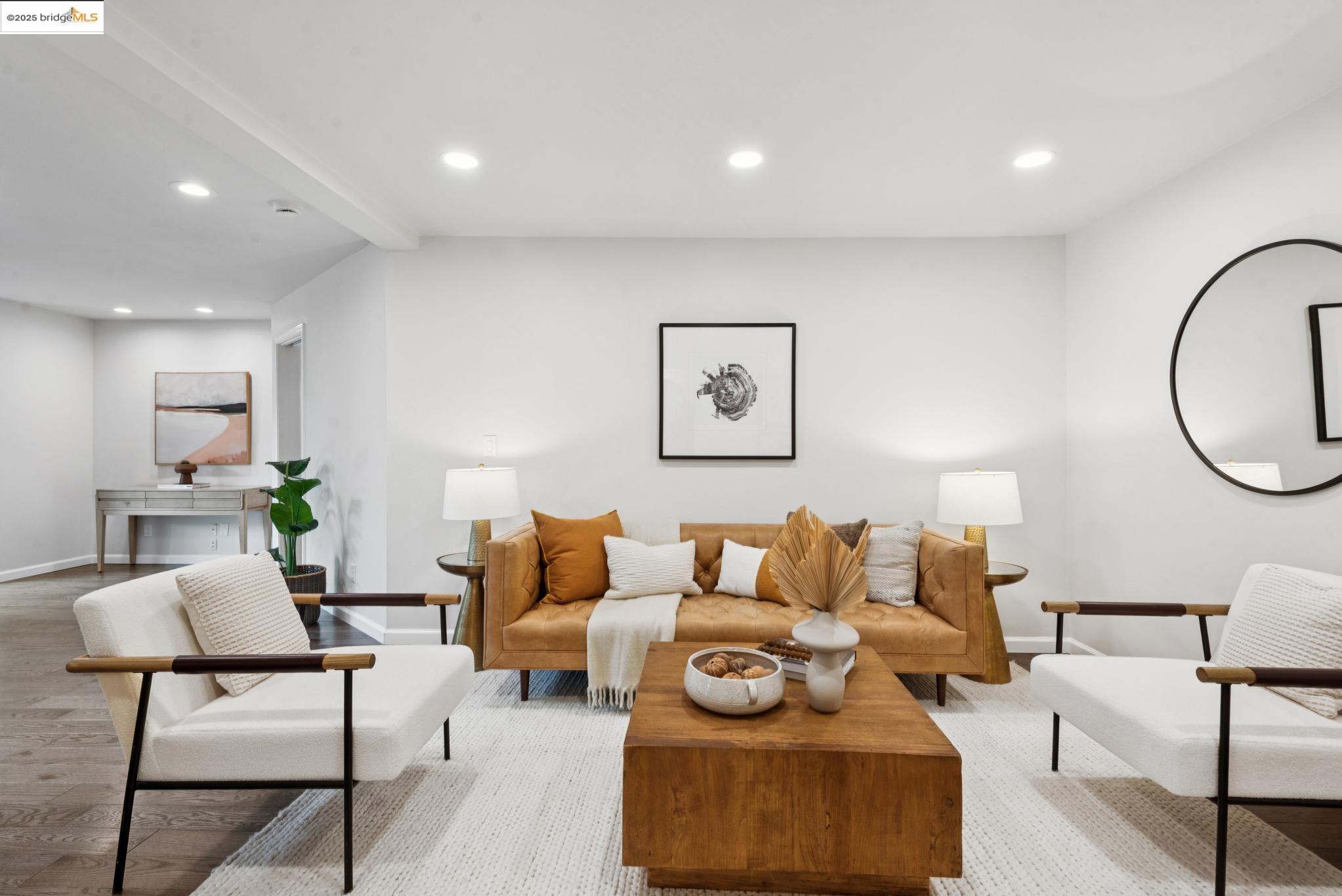 2861 Chelsea Drive Oakland, CA 94611 - Photo 44 of 56 a living room with furniture a rug and a mirror