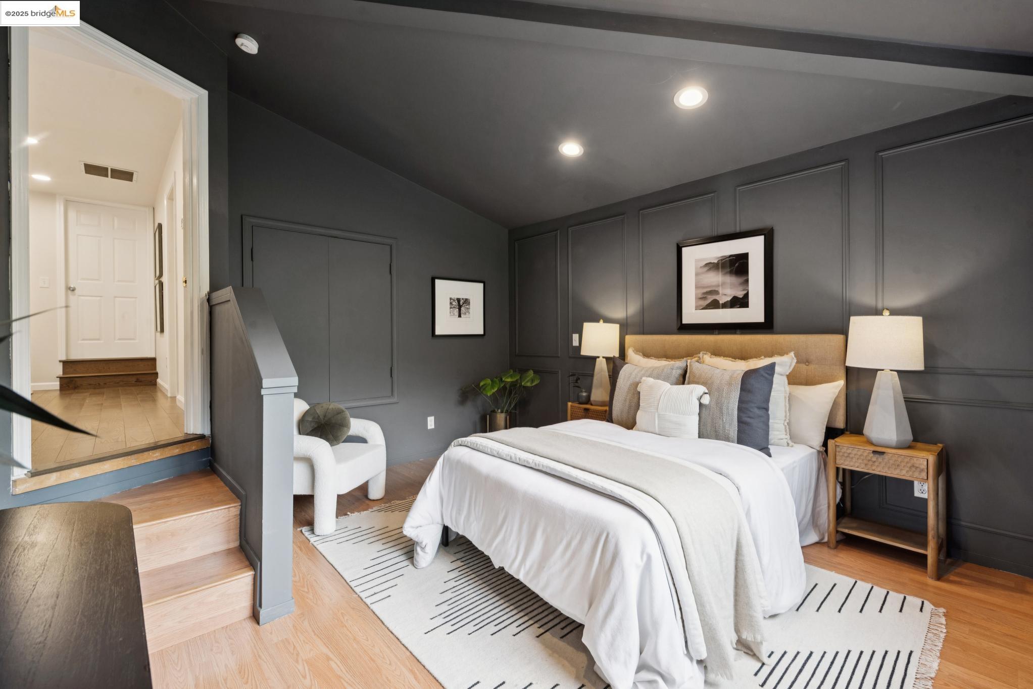 2861 Chelsea Drive Oakland, CA 94611 - Photo 48 of 56 a bedroom with a bed and a lamp with the wooden floor