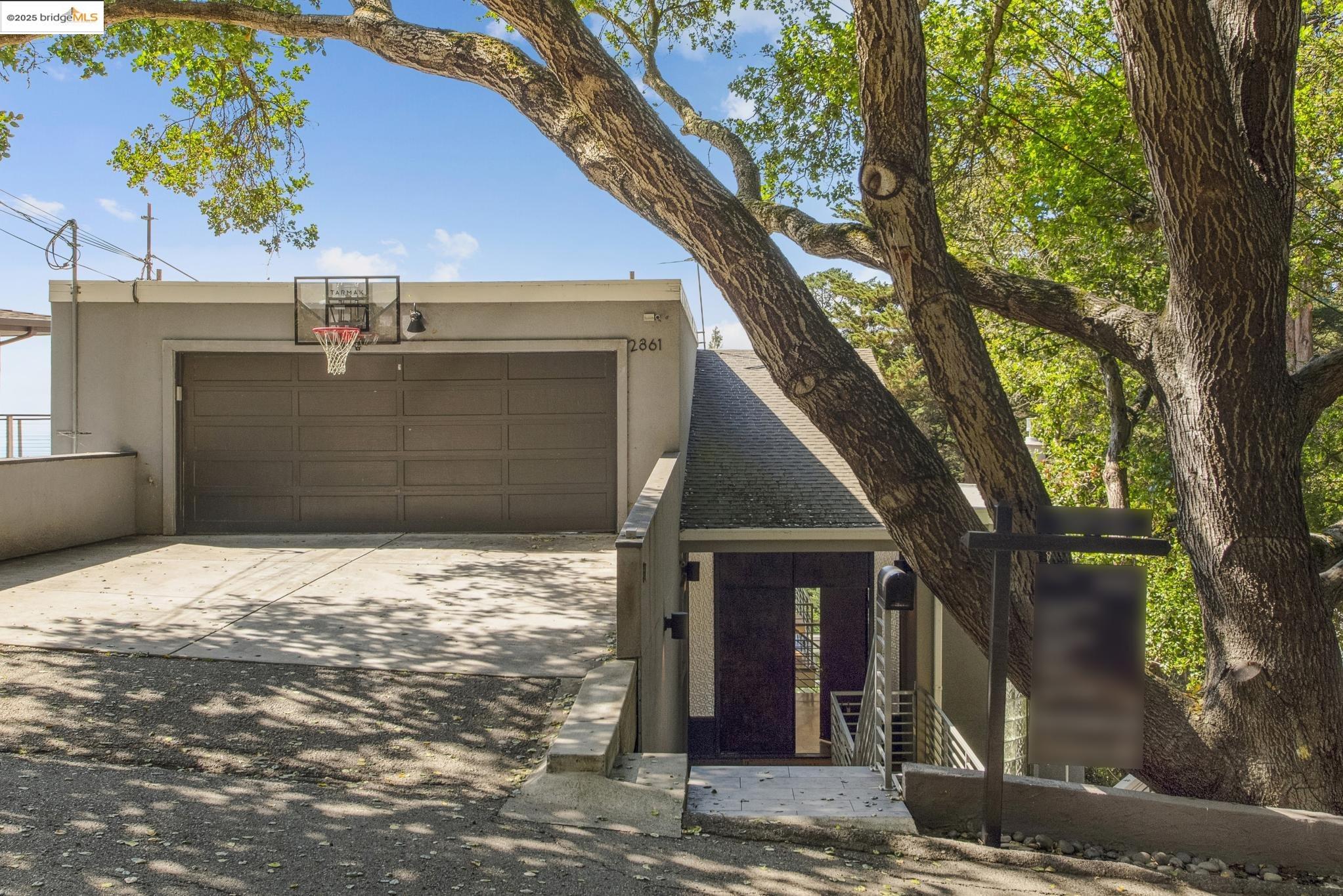 2861 Chelsea Drive Oakland, CA 94611 - Photo 55 of 56 a view of a house with a tree