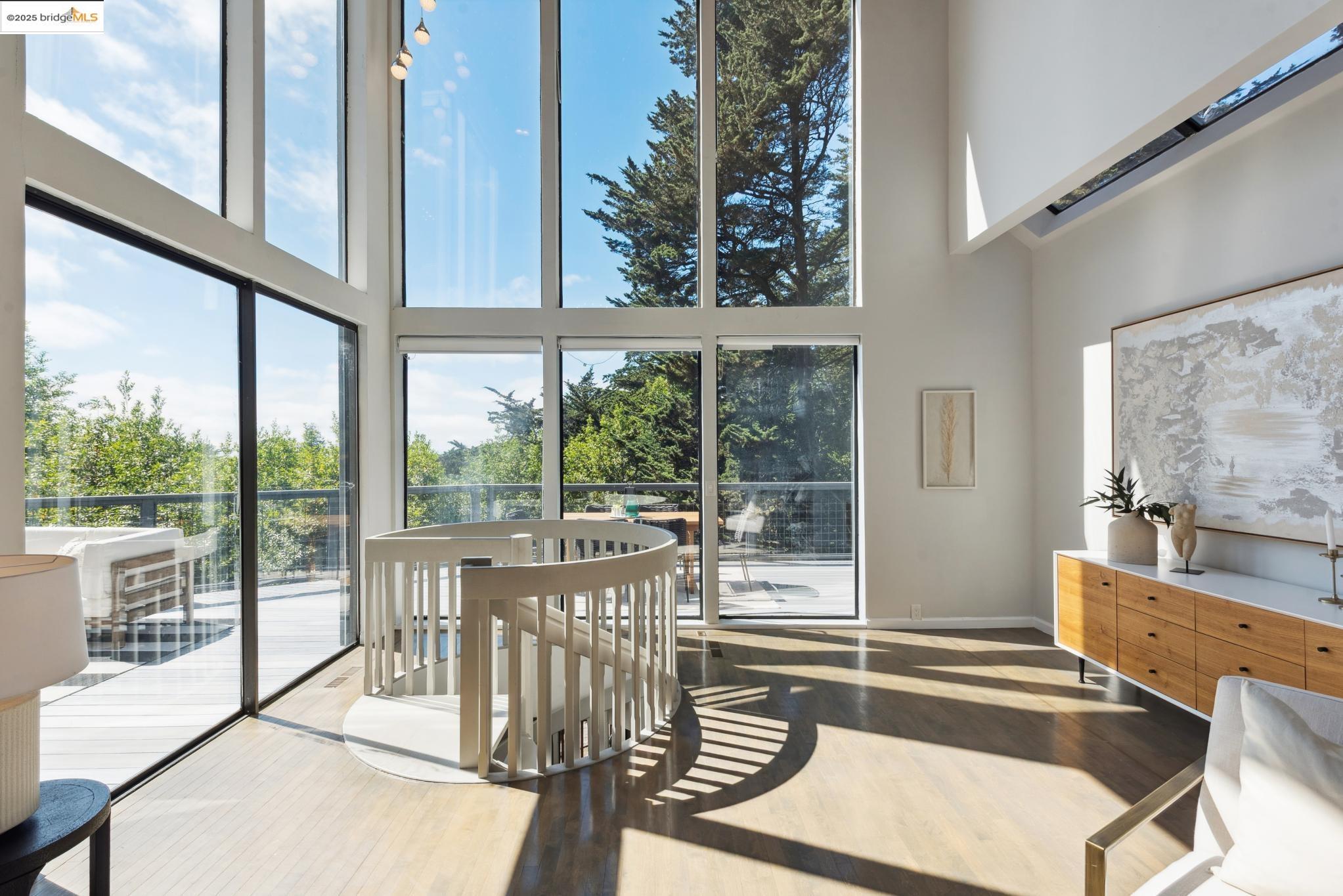 2861 Chelsea Drive Oakland, CA 94611 - Photo 7 of 56 a room with balcony furniture and floor to ceiling windows