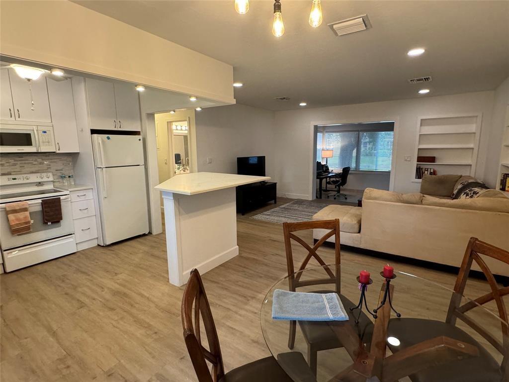 718 Northeast 5th Avenue Pompano Beach, FL 33060 - Photo 11 of 32 a living room with fireplace furniture and a wooden floor