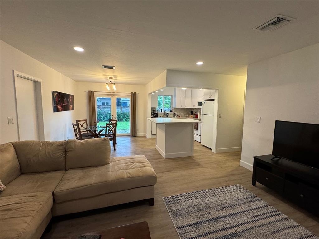718 Northeast 5th Avenue Pompano Beach, FL 33060 - Photo 12 of 32 a living room with furniture and a flat screen tv