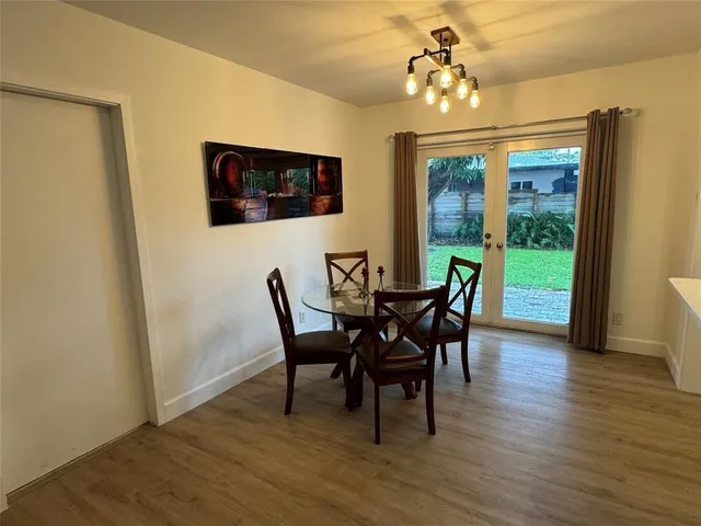 a dining room with furniture window wooden floor