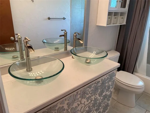 a bathroom with a toilet and a sink