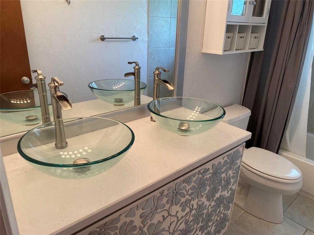 718 Northeast 5th Avenue Pompano Beach, FL 33060 - Photo 16 of 32 a bathroom with a toilet and a sink