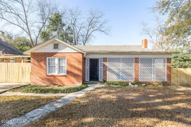 a front view of a house with a garage