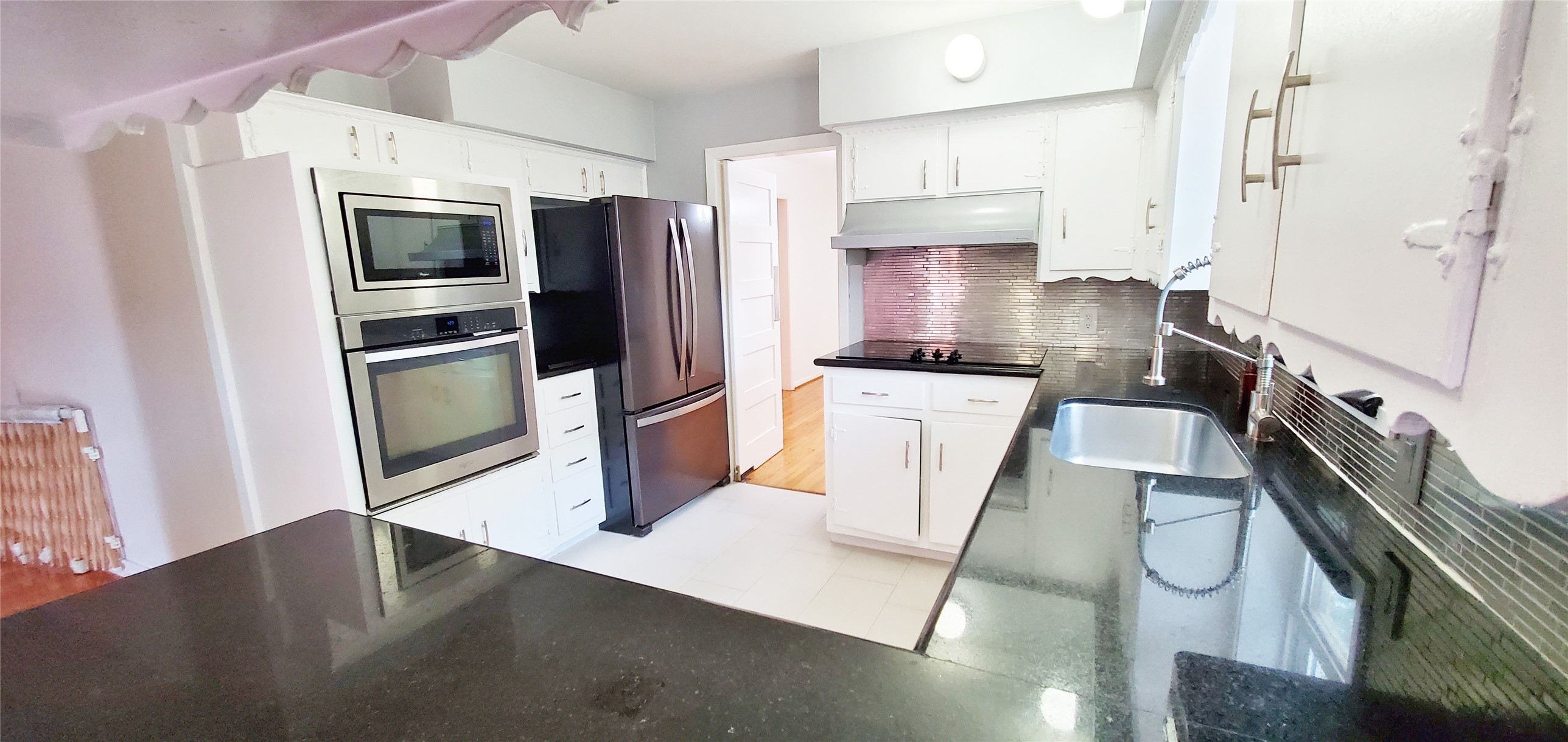 5630 Edith Street Houston, TX 77081 - Photo 7 of 30 Kitchen with large serving counter space to breakfast area.