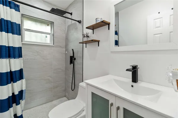 a view of a house with a snow in the yard