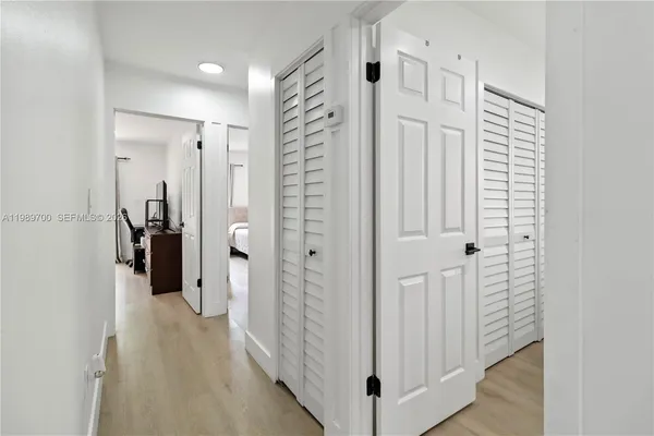 a view of a patio with table and chairs potted plants