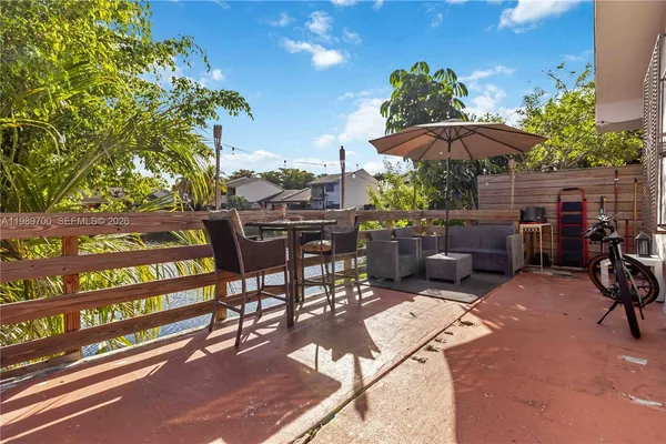 an aerial view of residential house with outdoor space and lake view