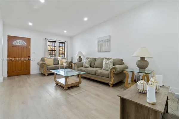 a living room with furniture and a window