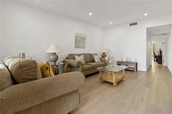 a view of a dining room with furniture and a window