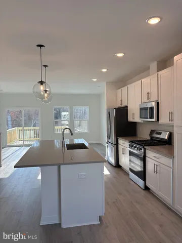 a white toilet sitting next to a bathroom sink