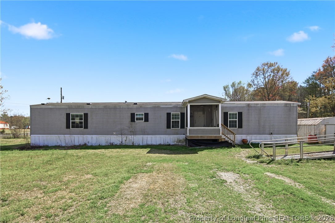 8637 Durant Nixon Road Linden, NC 28356 - Photo 14 of 36 a house view with a outdoor space