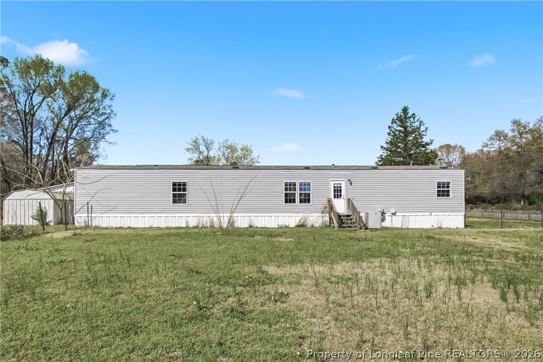 8637 Durant Nixon Road Linden, NC 28356 - Photo 15 of 36 a view of a house with a yard