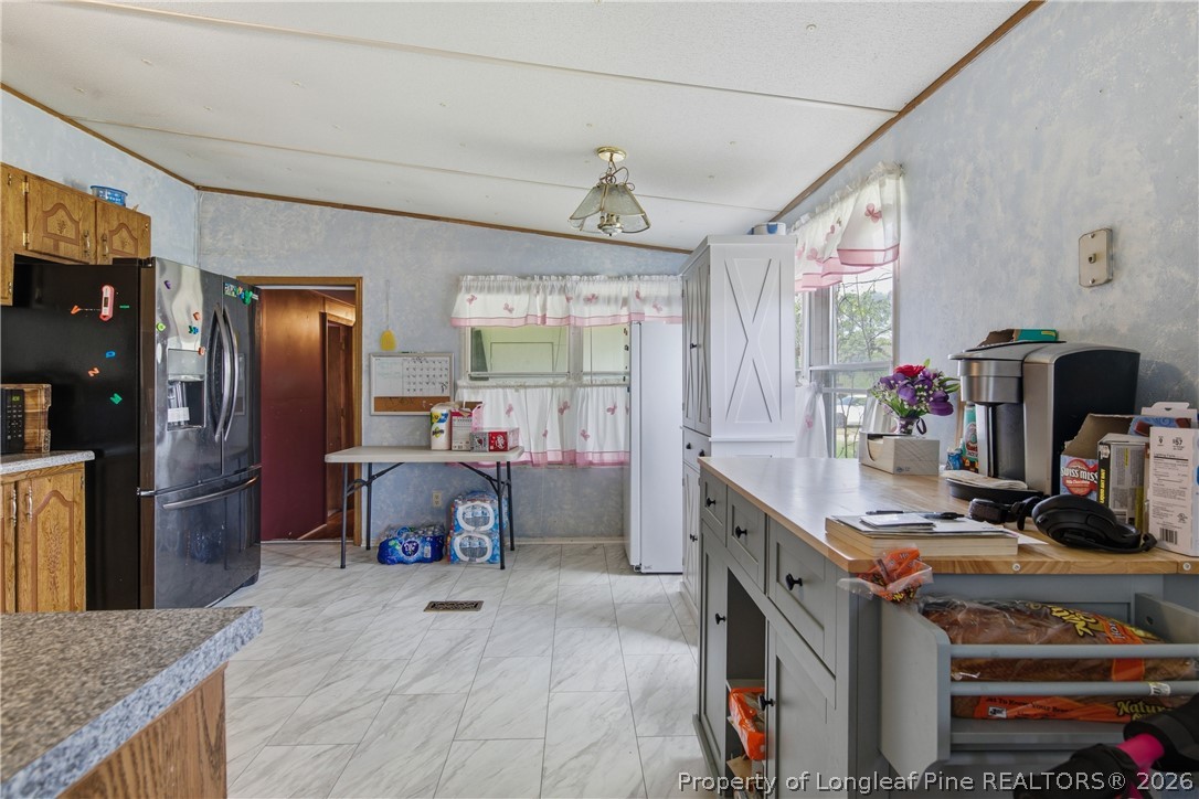 8637 Durant Nixon Road Linden, NC 28356 - Photo 21 of 36 a kitchen with stainless steel appliances granite countertop a sink dishwasher stove and refrigerator